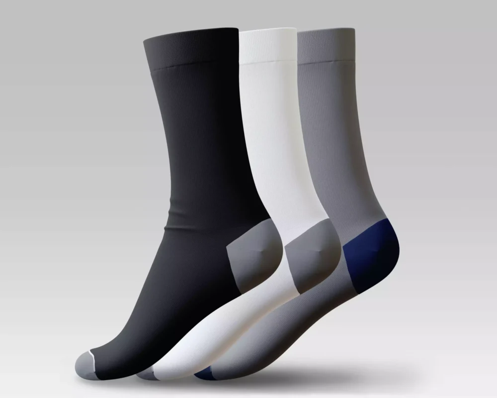 Three pairs of men's long half cushioned socks – 3-pack with light padding in black, white, and gray tones, made from Egyptian cotton by Stitch
